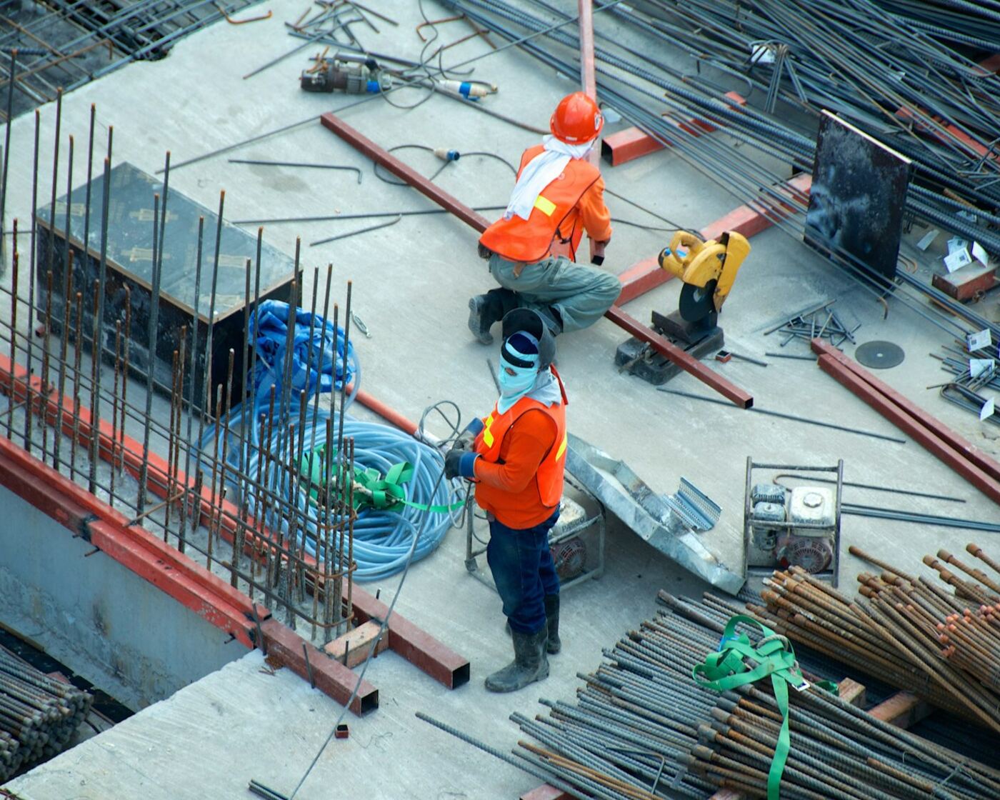 Construction crew working with rebar on a jobsite floor